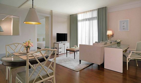 Separate living and dining room in One Bedroom Suite City View